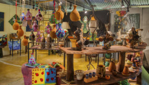 Lucky Bug Gallery in Costa Rica, showcasing vibrant local art and handcrafted pieces surrounded by lush tropical greenery.