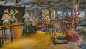 Art gallery at a Costa Rica investment property featuring local artwork and a vibrant, welcoming interior.